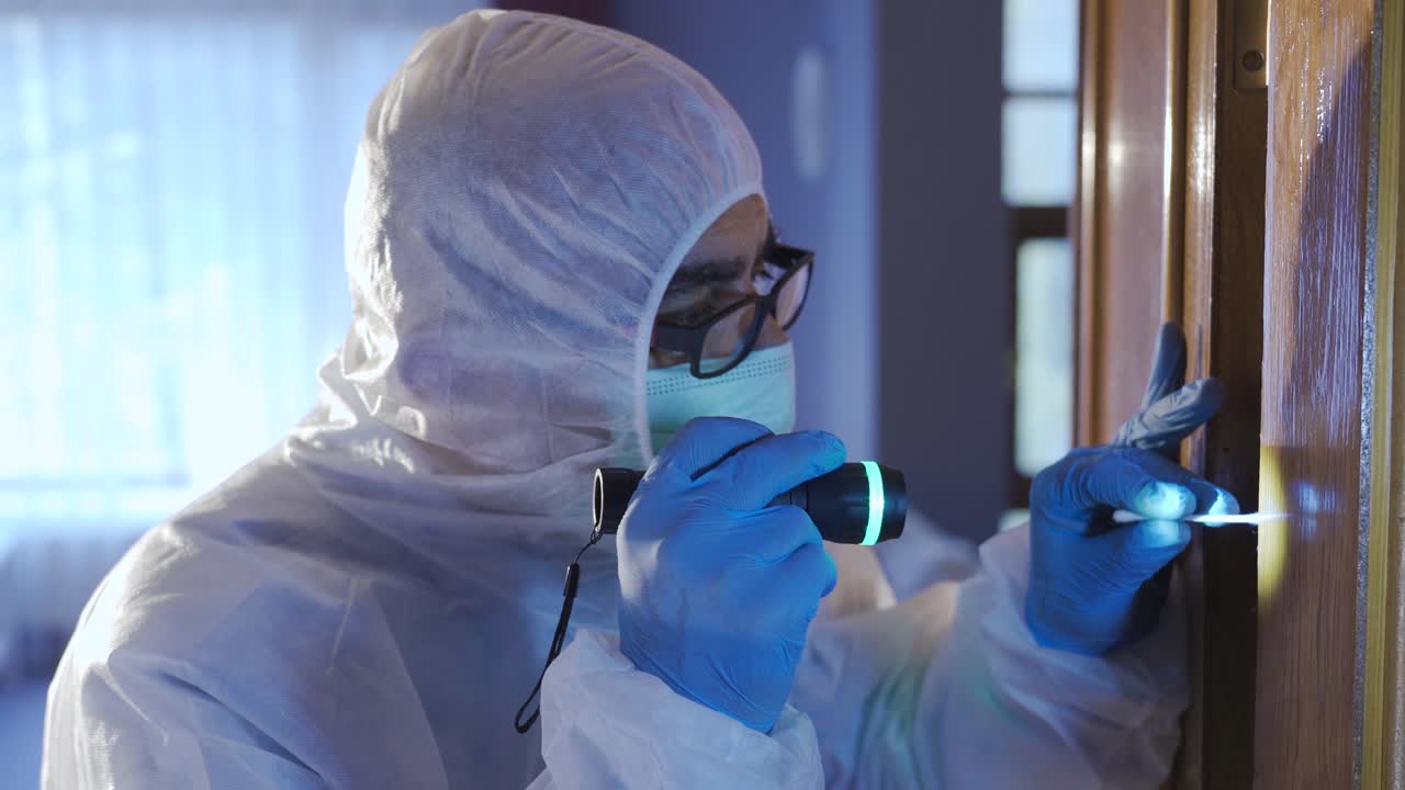 Forensic expert working at the crime scene.