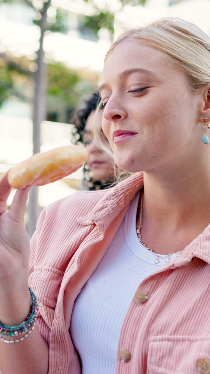 Woman enjoying a donut outdoors