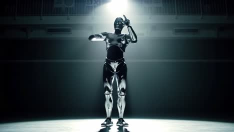 a futuristic dance showdown: a sleek, metallic robot showcases impressive dance moves under dramatic lighting, capturing the essence of artistry and technology