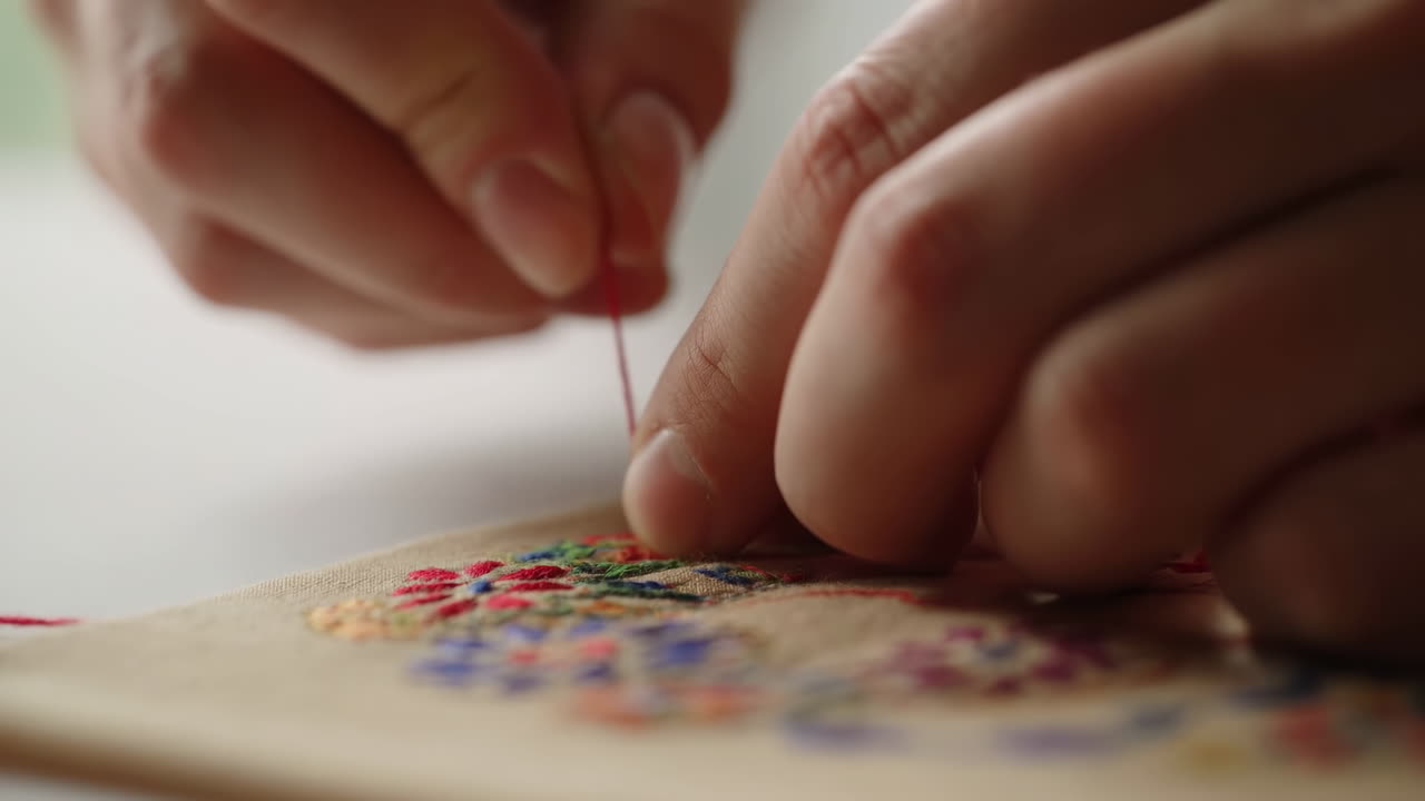 Close-up of Hands Doing Colorful Floral Embroidery