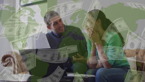 animation of dollar banknotes over diverse couple using laptop