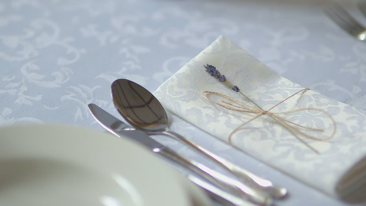 Elegant Table Setting Decorated with Lavender and Silverware