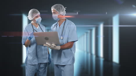 animación de médicos que usan máscaras de coronavirus y usan una computadora portátil