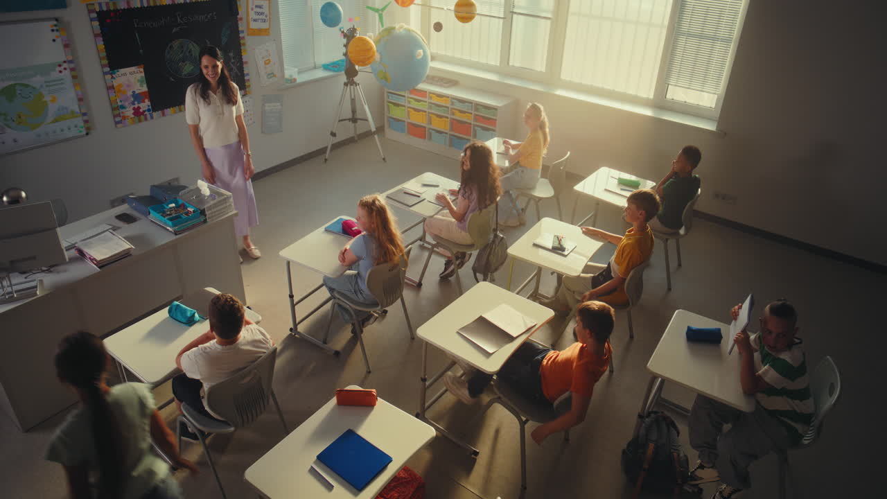 Primary School Children Raising Hands Smart Boy Presenting Homework on Renewable Energy