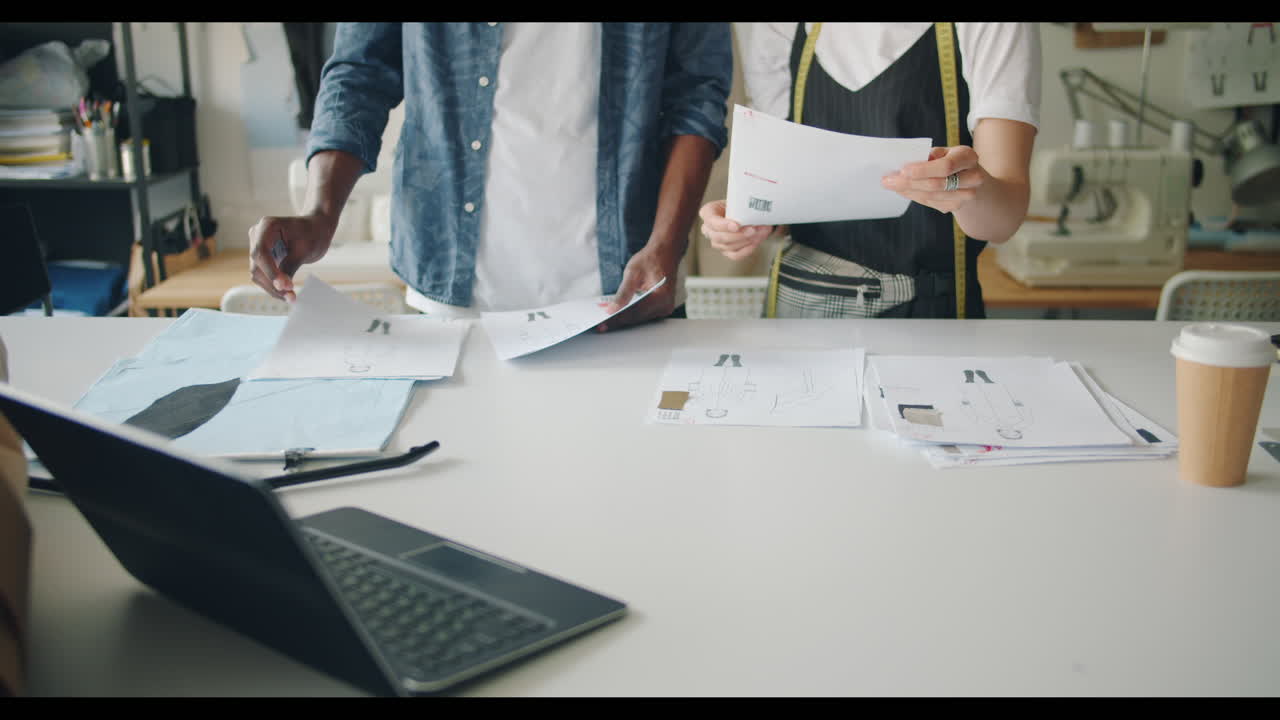 Fashion Designers Collaborating on Designs