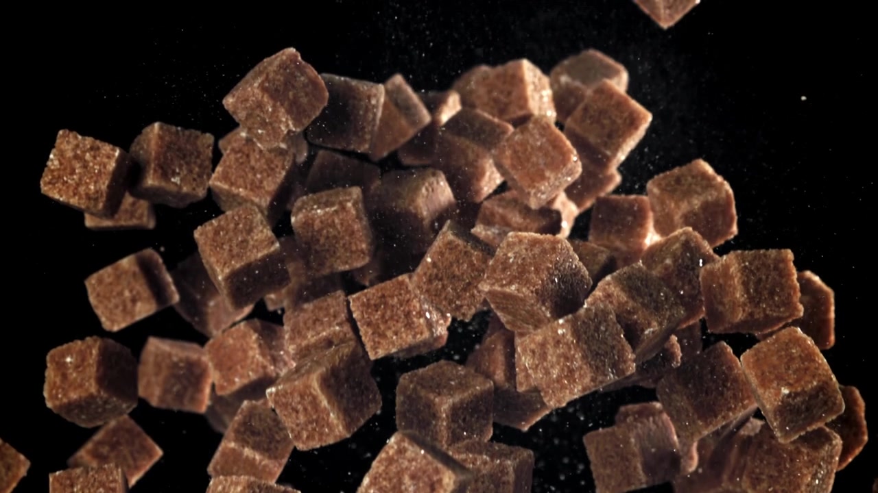 Brown Sugar Cubes Falling and Floating in Slow Motion