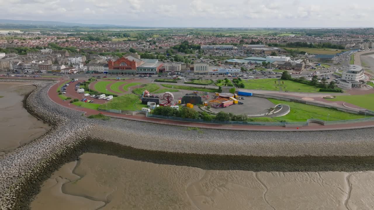 Slow Orbit Of Proposed Eden Project Site. Manicured Lawn Headland With Stone Sea Defences. Summer. Marine Road Central, Morecambe, Lancashire, UK