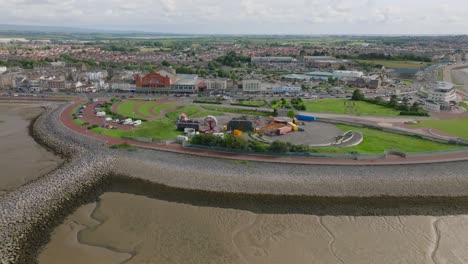 slow orbit of proposed eden project site. manicured lawn headland with stone sea defences. summer. marine road central, morecambe, lancashire, uk