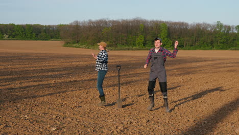 happy farmers working in a field