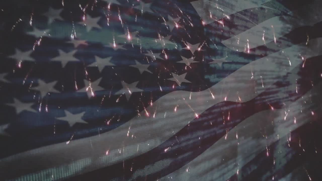 Animation of flag of america waving over fireworks