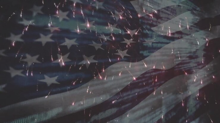 Animation of flag of america waving over fireworks