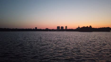 park lake waves at sunset. beautiful calm scenery