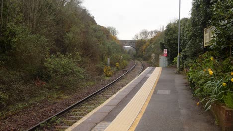 zoom in on perranwell train station platform end, looking towards turo