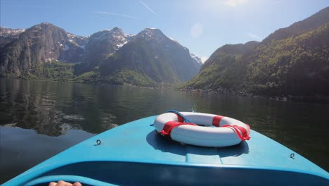 boat trip on a beautiful alpine lake with snow capped mountains