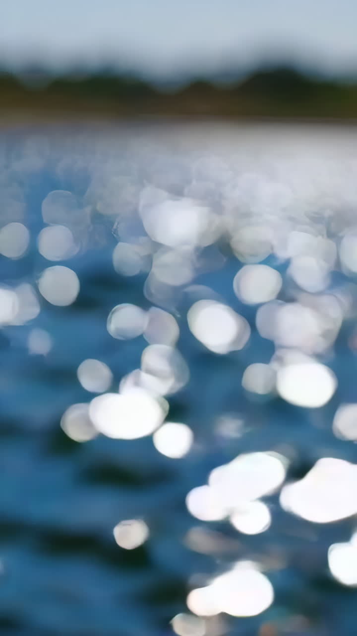 Sunlight Reflections on Blue Water with Bokeh Effect