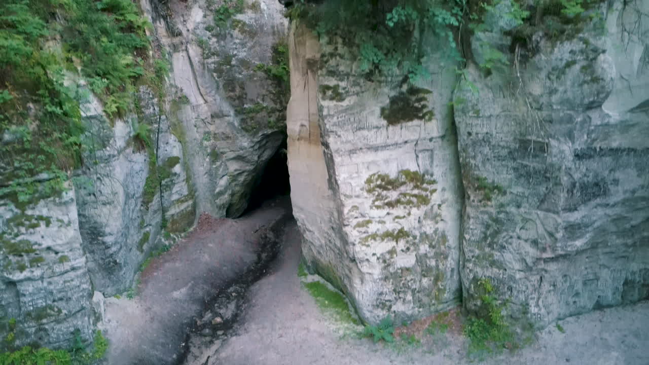 Devil's Oven or Large Ellite Natural Geological Monument  Located in the Gauja National Park at Lode Behind Cesis in Latvia. Licu – Langu Sandstone Cliffs Liepa Cave. Aerial Dron Shoot.
