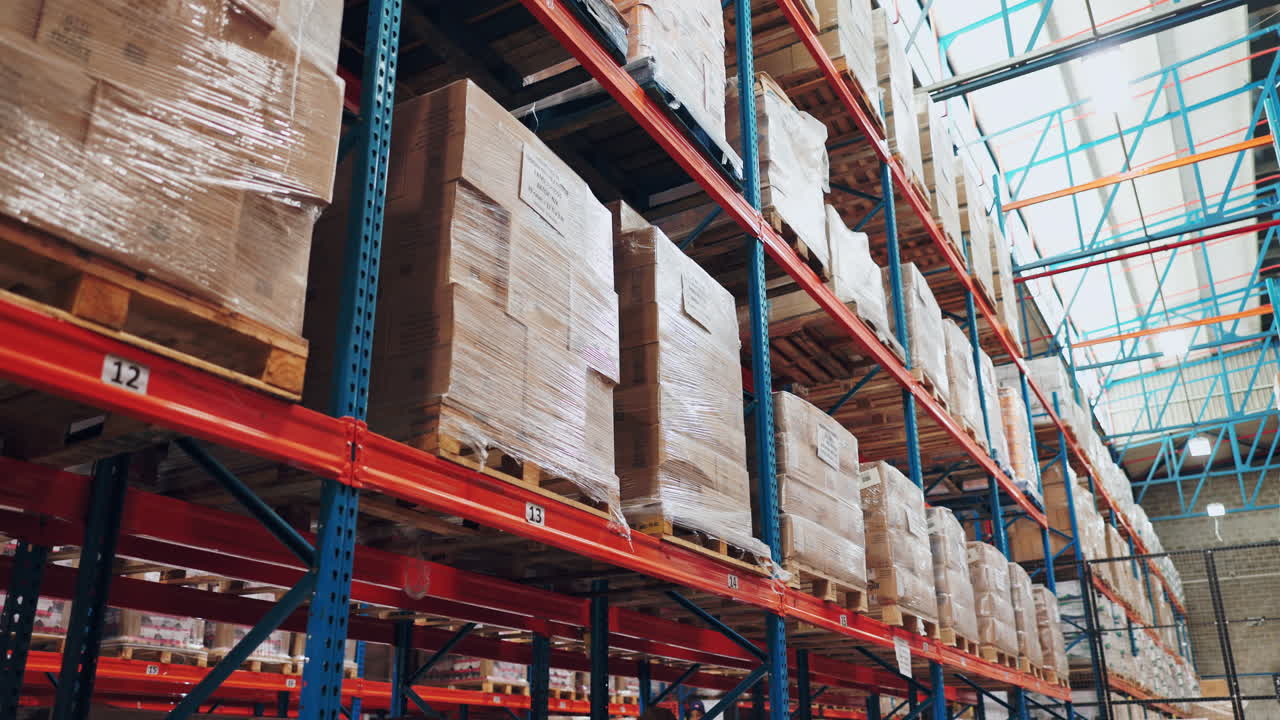 Warehouse shelves filled with pallets of boxes