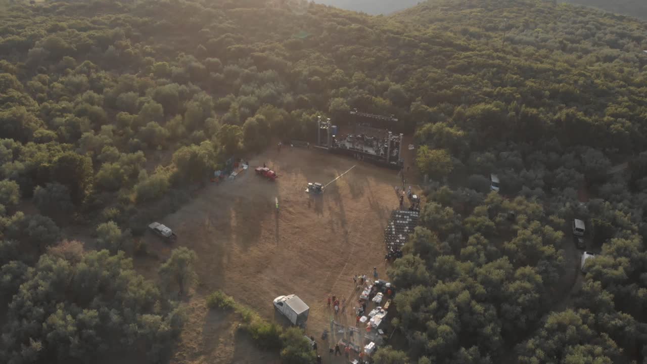 aerial drone footage of amazing landscape of green mountain with small village and beautiful blue sky with amazing Aegean sea at background Thessaly Greece