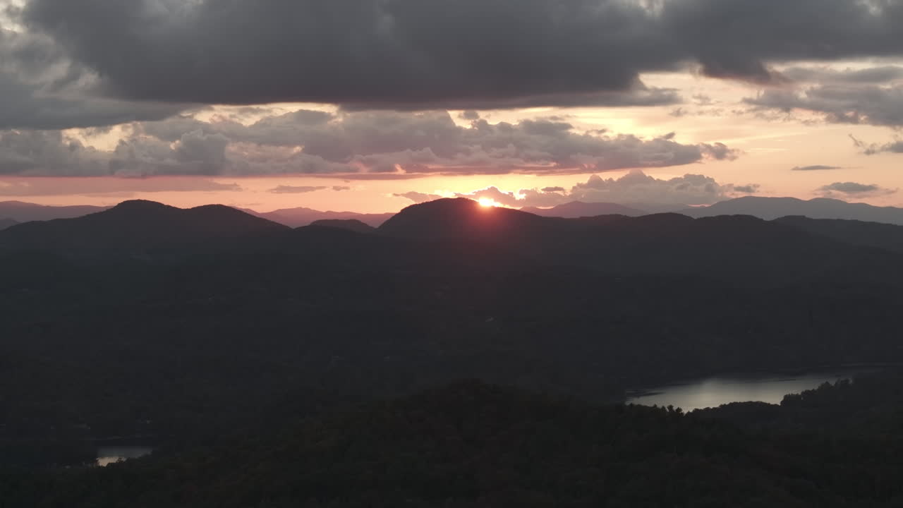 Aerial perspective of North Carolina’s mountain landscape and lake Glenville, alive with the warm hues of fall foliage