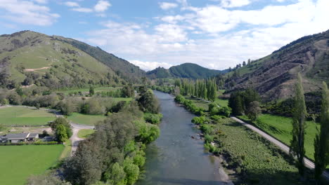 slow drone shot flying over the motueka river in new zealand