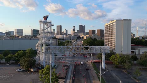 static aerial shot of the 1996 olympic cauldron and downtown at sunset.