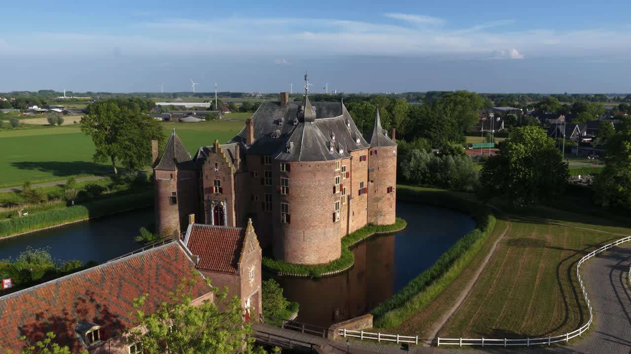 Ammersoyen Castle is a castle in Ammerzoden. Monument, histroic building, tower, walls, aerial video, building exterior.