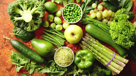 Fresh-green-vegetables-and-fruits-assortment-placed-on-a-rusty-metal