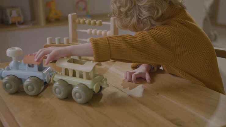 Little boy playing with eco toy