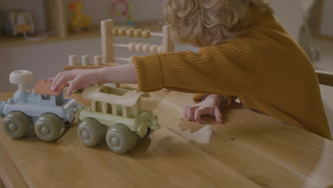 little boy playing with eco toy