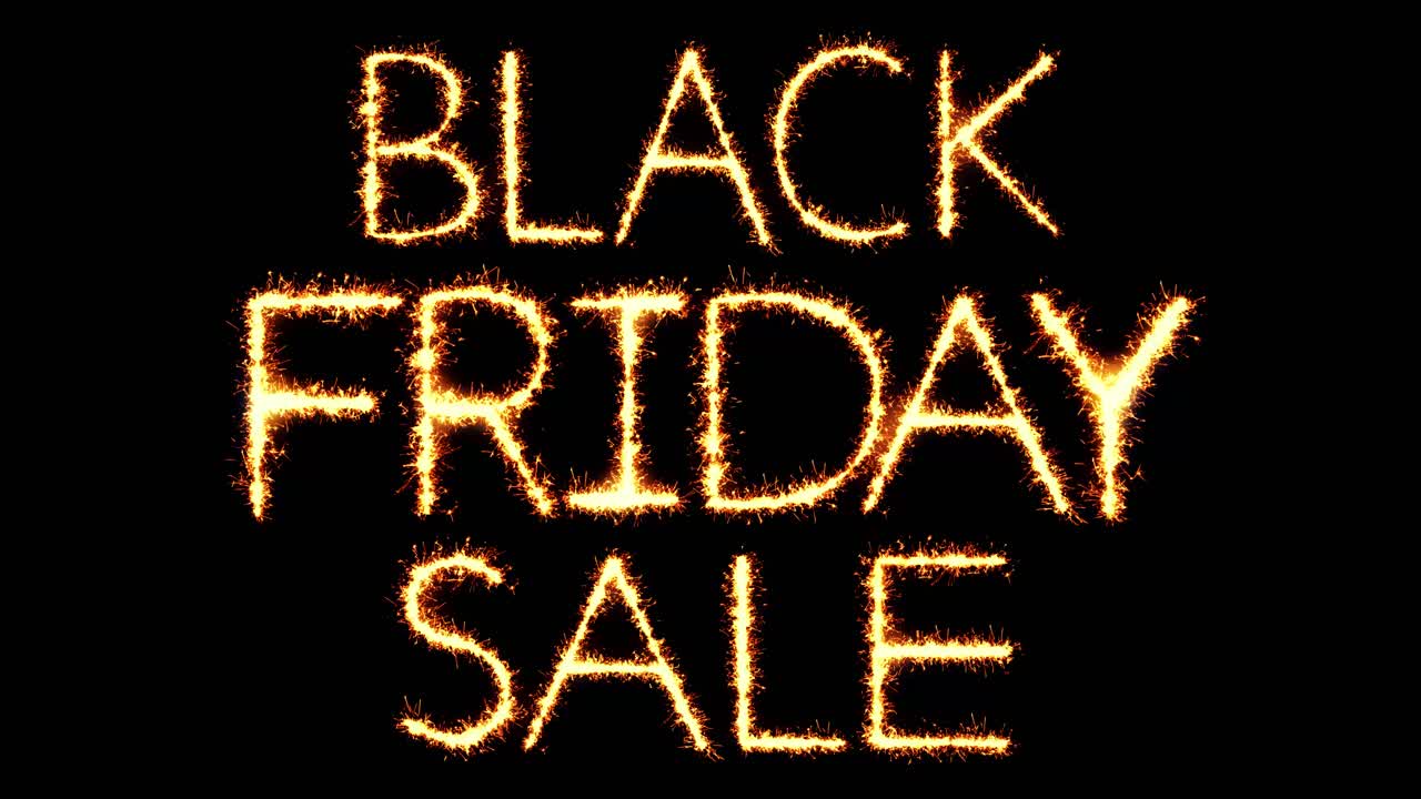 Black friday sale text sparkler writing with glitter sparks particles firework on black 4k loop