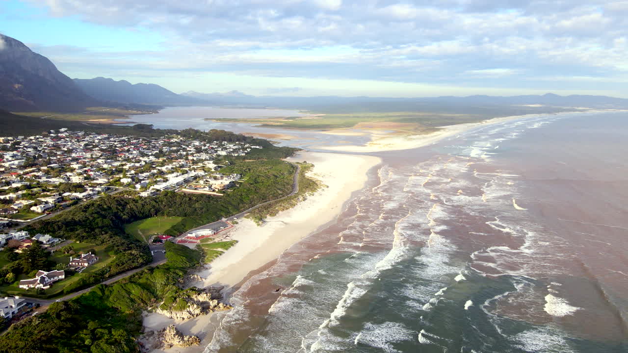 Scenic Hermanus white sand Grotto beach and Klein River Lagoon. Aerial view