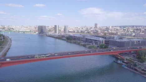 Descending-establishing-aerial-shot-of-Gazela-bridge-and-Sava-river,-Belgrade