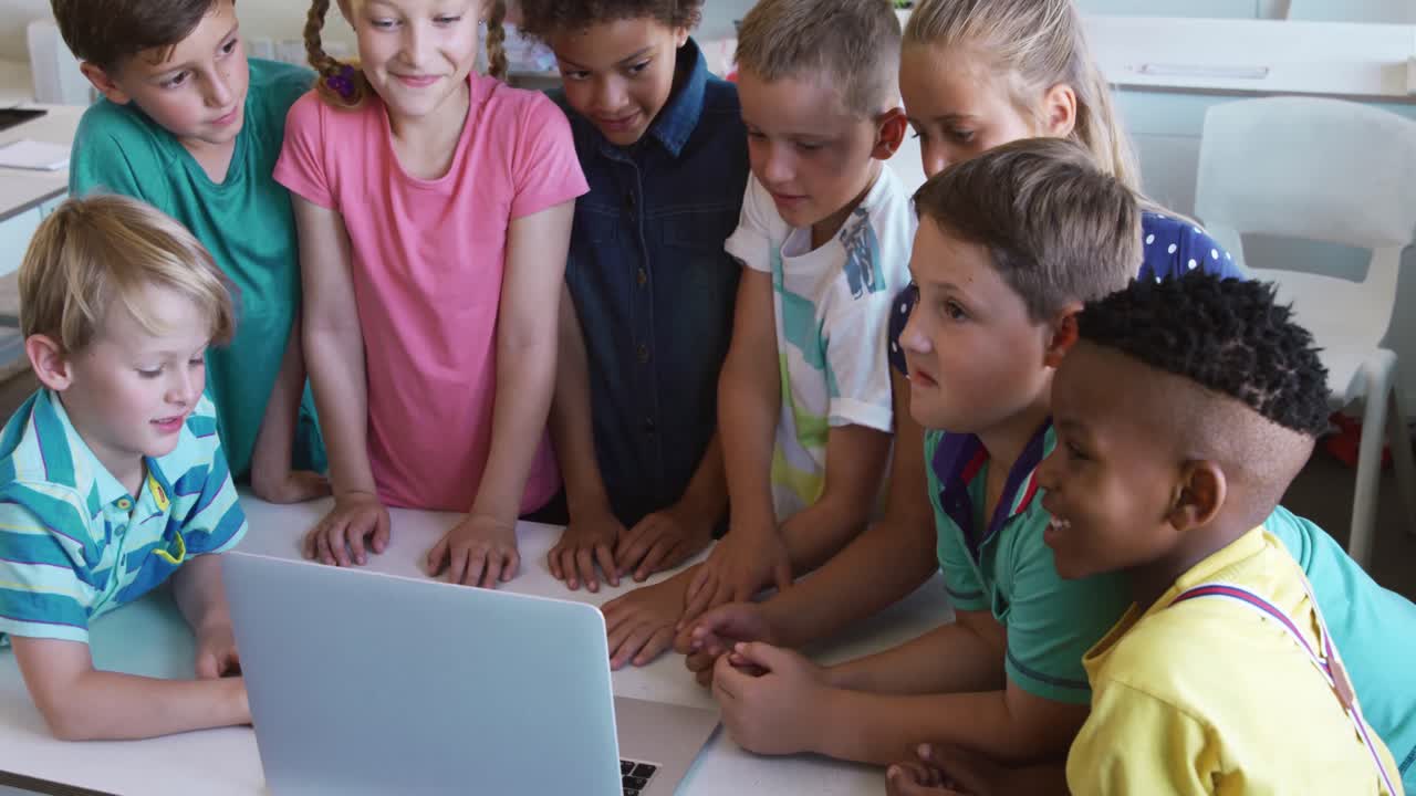 Group of kids using laptop in the class