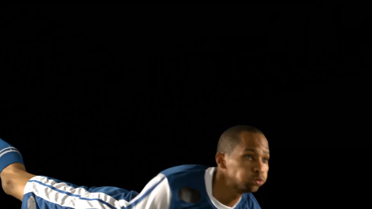 Football player heading the ball
