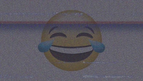 digital animation of tv static effect over laughing face emoji against grey background