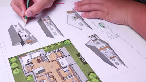 sketching the additional features of an architectural design master plan of a residential building