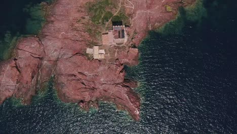 Impressive-Ancient-Stone-Tower-Situated-On-The-Private-Island-Of-I'lle-D'or-France---aerial-shot