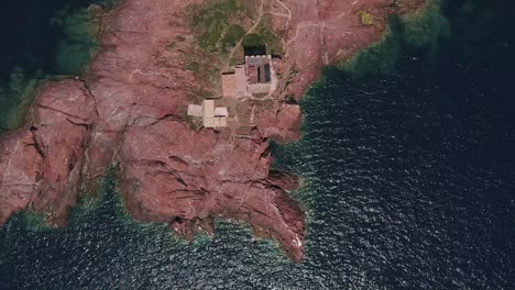 impressive ancient stone tower situated on the private island of i'lle d'or france - aerial shot