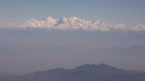 Scenic-aerial-flight-over-the-worlds-largest-mountains,-the-Himalayas-with-views-of-Mount-Everest-and-jagged-snowcapped-peaks