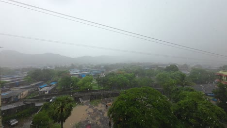 raining heavy mask over mountains motion building balcony rainy season