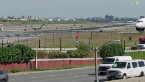 commercial jet crosses frame while taxiing prior to take-off at nyc's laguardia airport