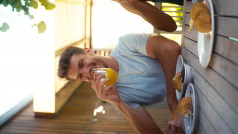 Vertical-Video-Of-Smiling-Multi-Cultural-Friends-Eating-Breakfast-Outdoors-At-Home-Making-A-Toast