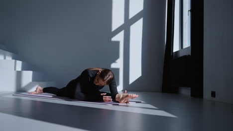 woman doing a yoga stretch