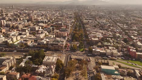timelapse capturing the bustling urban life of de chile, with wide panoramic view showcasing city buildings, roads, and moving traffic during day.