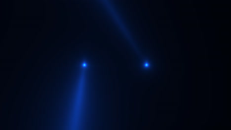 Blue-glowing-spotlight-beams-on-black-gradient-stage