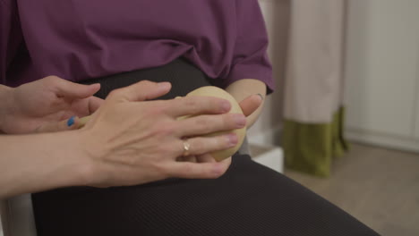 pregnant woman holding toy baby