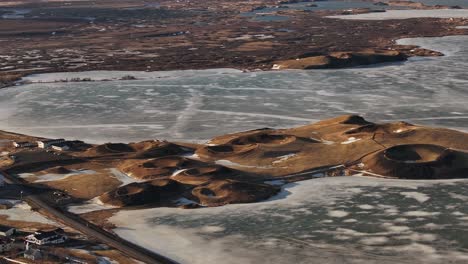 aerial view of skútustaðir pseudocraters on frozen lake mývatn near reykjahlíð. iceland