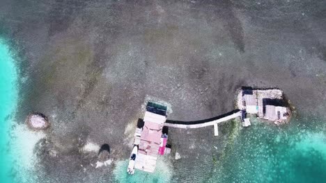 AERIAL-TOP-VIEW-PALAFITO-KITESURF-SPOT-LANDSCAPE-ARCHIPELAGO-LOS-ROQUES-VENEZUELA