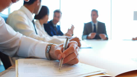 Business-team-sitting-down-discussing-work