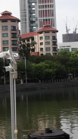 progressive construction of buildings by a river.